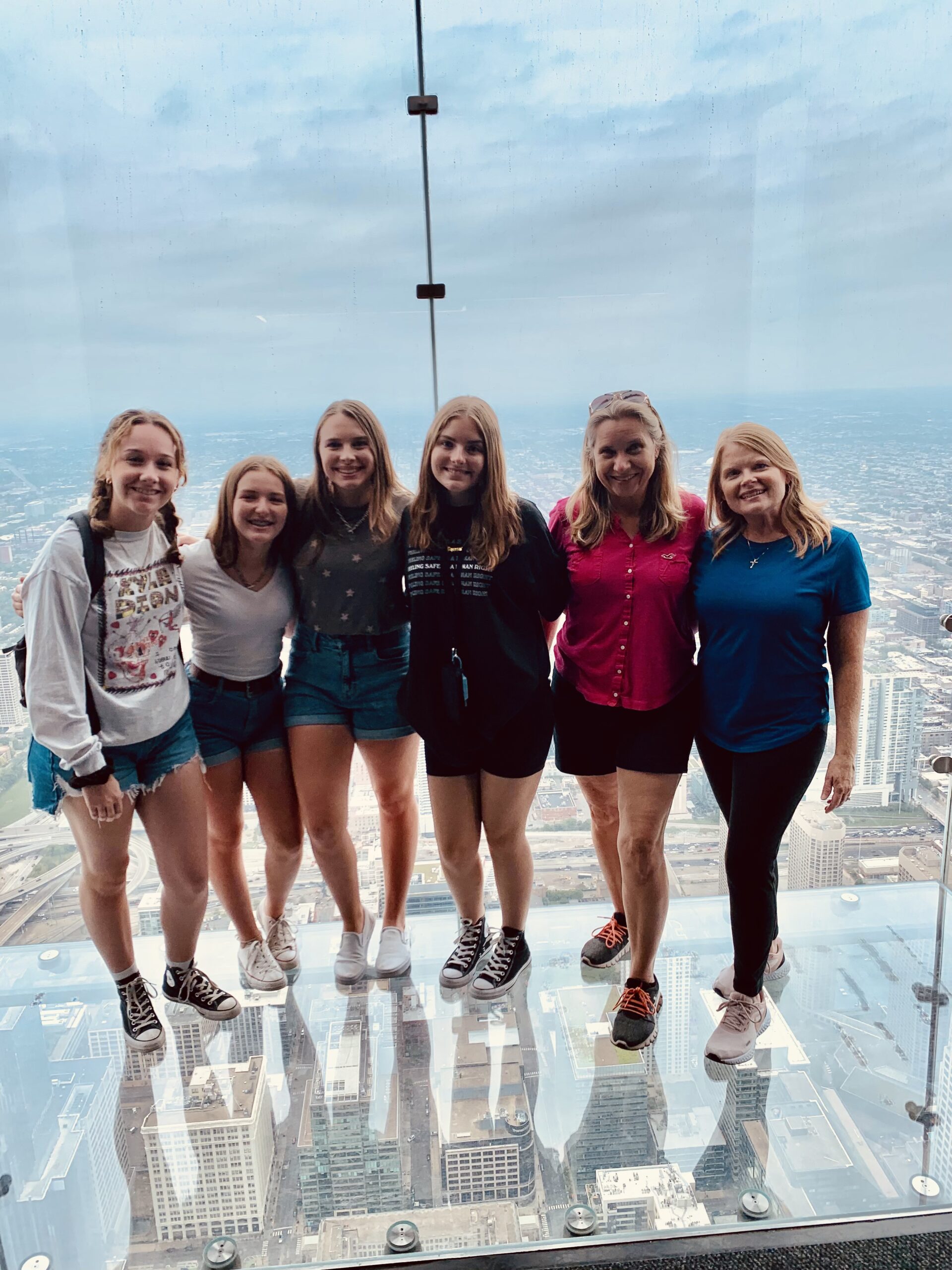 skydeck2021 First United Methodist Youth Grouiop Celebrating Christmas around at a party